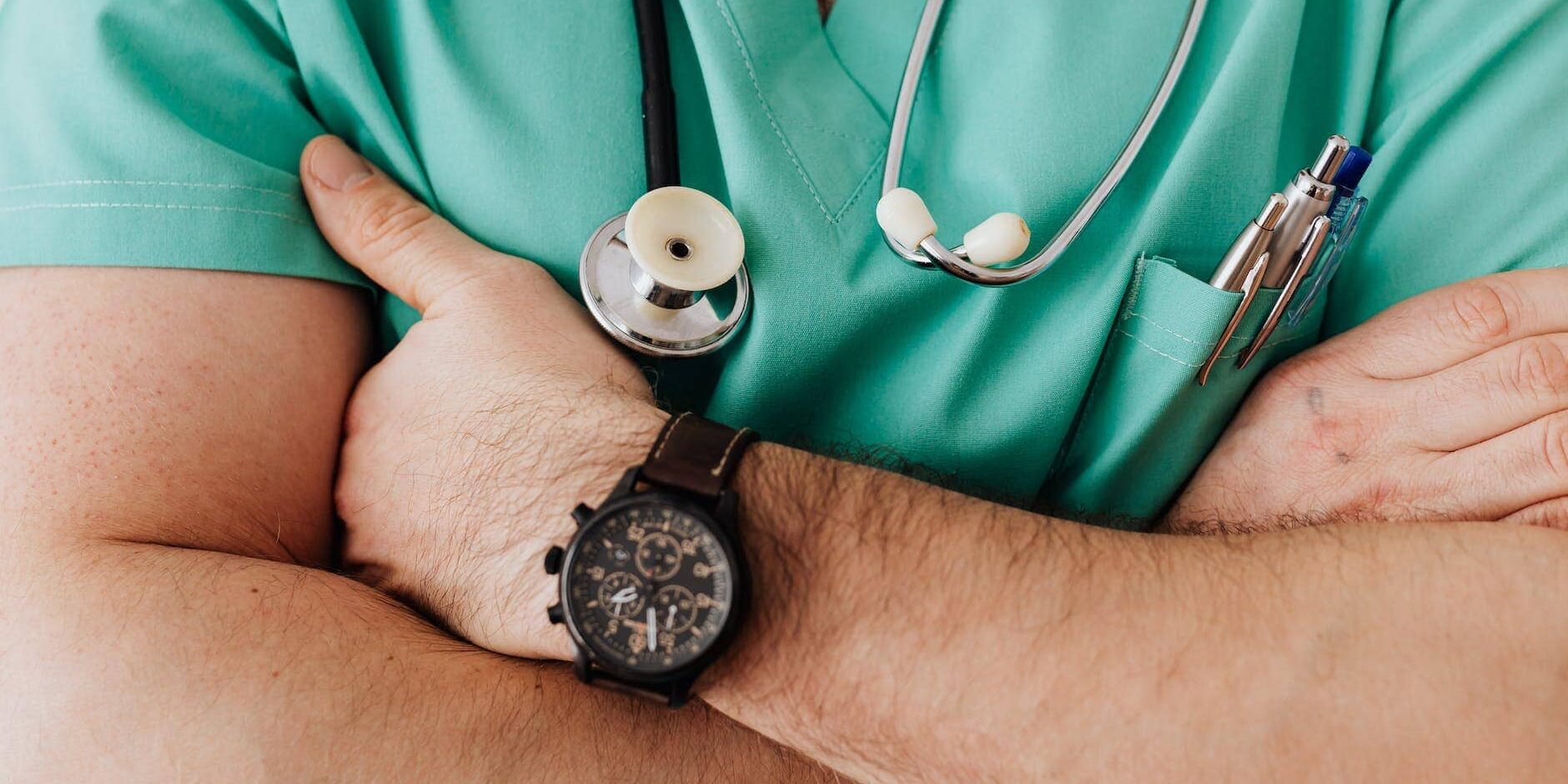 crop unrecognizable male doctor with stethoscope