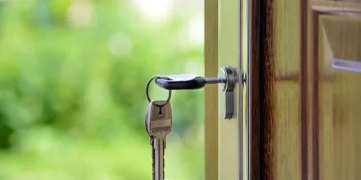 House key in front door
